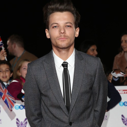 Grieving Louis Tomlinson performs days after mum's death