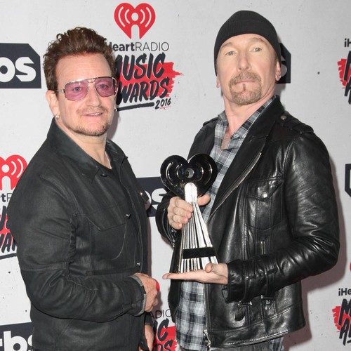 Bono can't watch footage of noble refugee during U2 shows