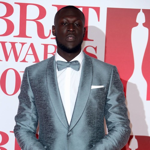 Stormzy receives piano lesson from Paul McCartney
