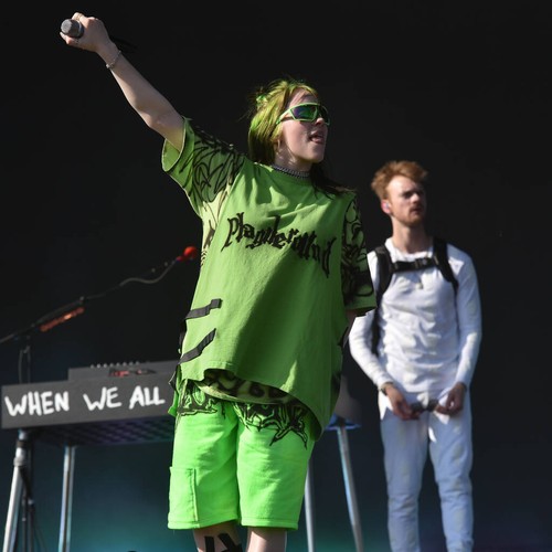 Billie Eilish performs with injured foot in support boot
