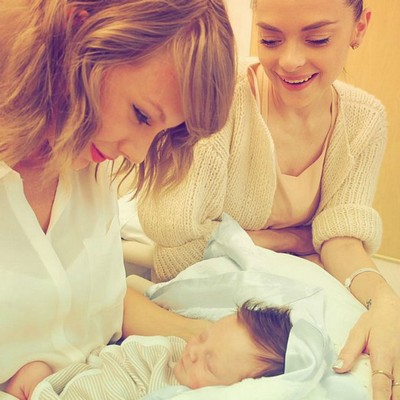 Taylor Swift meets godson Leo