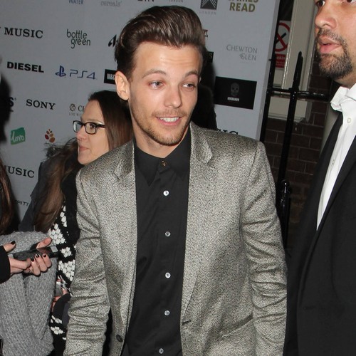 Louis Tomlinson 'is quickly learning to be a dad'