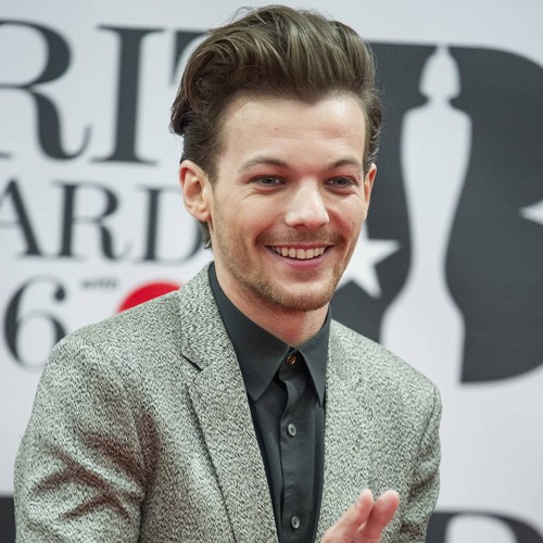 Louis Tomlinson's girlfriend topless on vacation