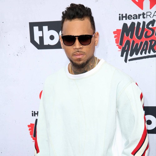Chris Brown blasts gun threat allegations as cops surround home