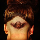 Lady-Gaga-gets-her-head-tattooed-in-front-of-crowd